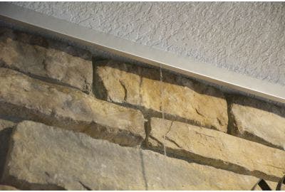 How To Hang Art on a Stone or Brick Fireplace