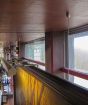 Framed art suspended from the ceiling by Short and silver Fixed Piers.