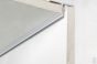Cross-section detail of shadowline ceiling track system installed between ceiling and wall for discreet picture hanging.