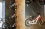 A group of three bicycles suspended from the ceiling by Loop Hangers and stainless steel cables.