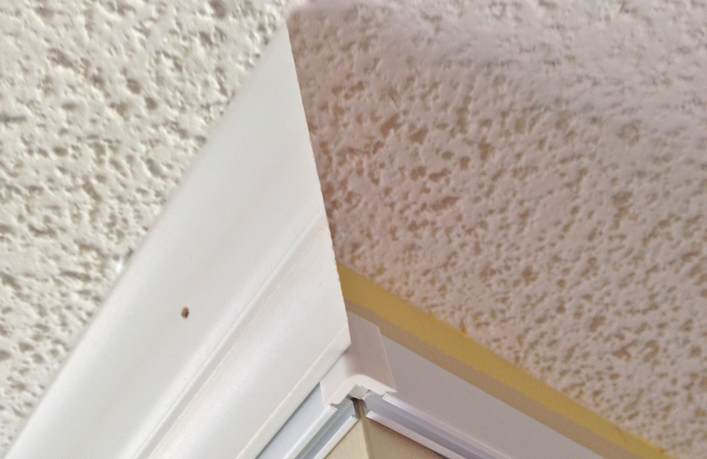 Corner Connectors at outside corner of crown molding.