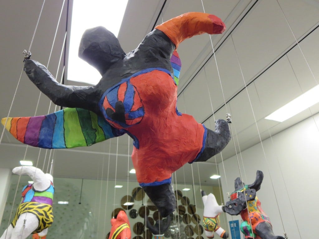 3D art floats mid-air using Mini Hooks on a tensioned cable system.