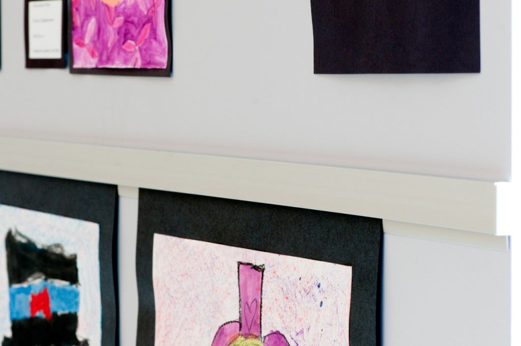 Casso® Display Rail makes perfect cork rail alternate to display students’ artwork.