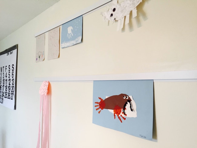 Casso® Display Rail displays children’s art without tape, sharps, push-pins, or magnets.