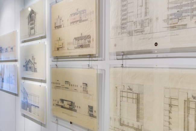 Vintage renderings sandwiched in acrylic by AS Hanging Display Systems.