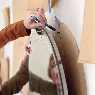 Southern-Living-Magazine-Hanging-Mirror-on-Wall-with-paper-template Southern Living Magazine showing using paper templates to hang art and wall objects