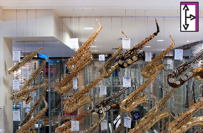 MUSIC STORE USES HANGING SYSTEM FOR MERCHANDISING